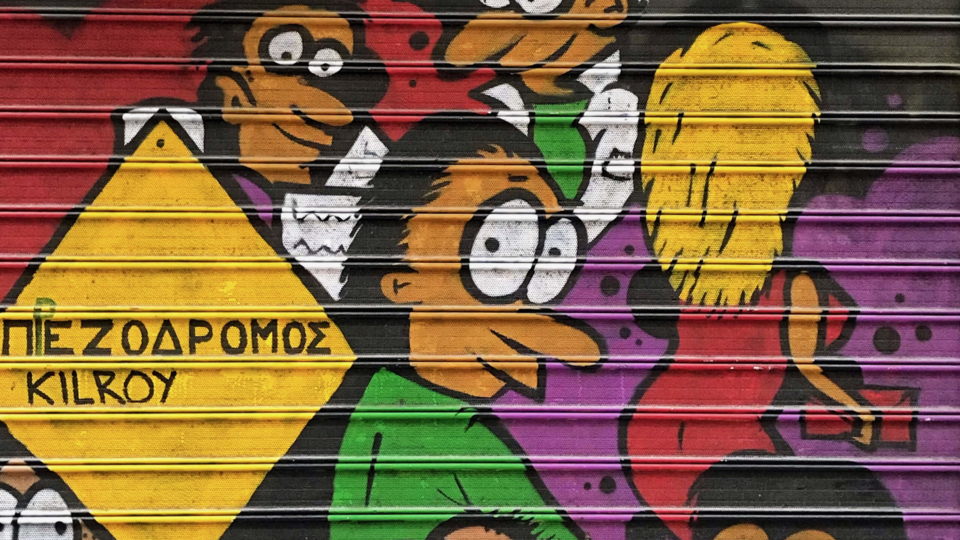 Street art on metal pull up door in Thessaloniki Greece